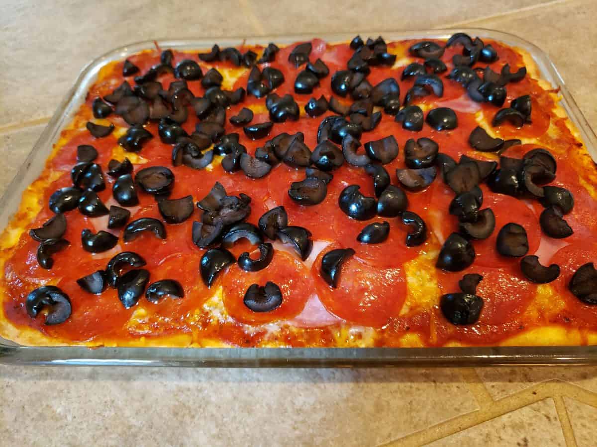 Bake the pizza at four hundred and twenty-five degrees Fahrenheit for thirteen minutes.