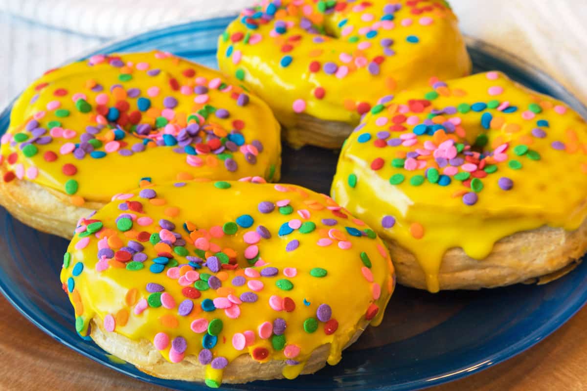 Easy air fryer biscuit donuts on a plate.