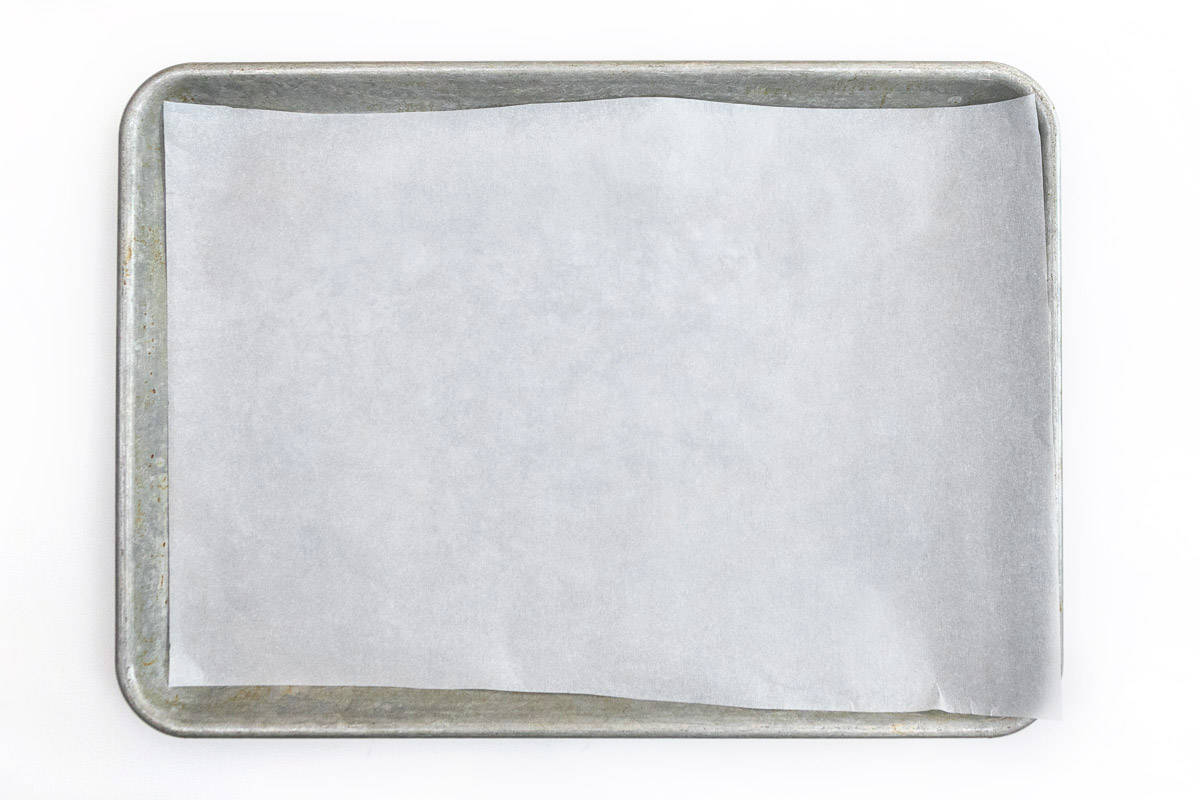 A baking sheet lined with parchment paper.