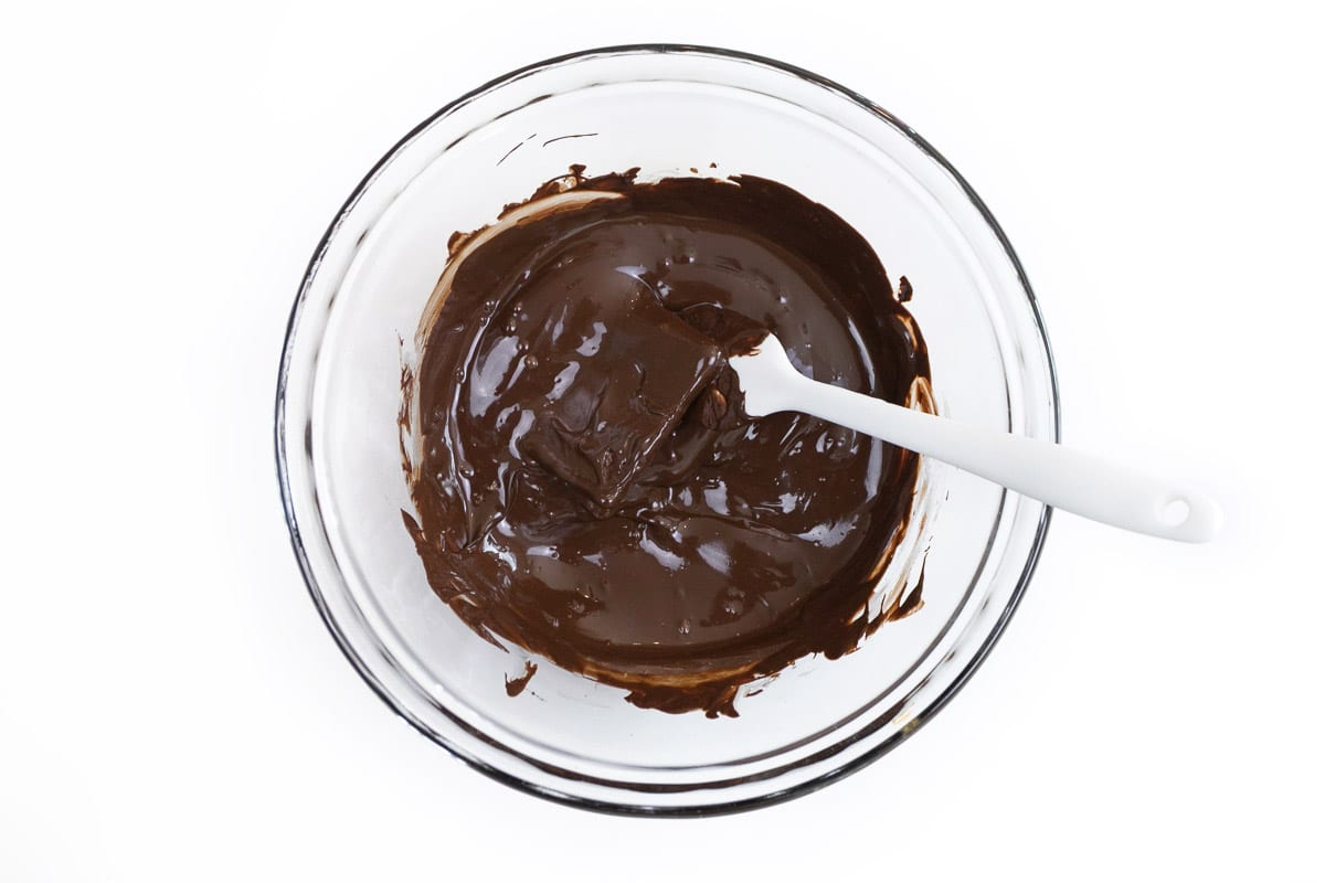 A graham cracker square dipped in melted chocolate.