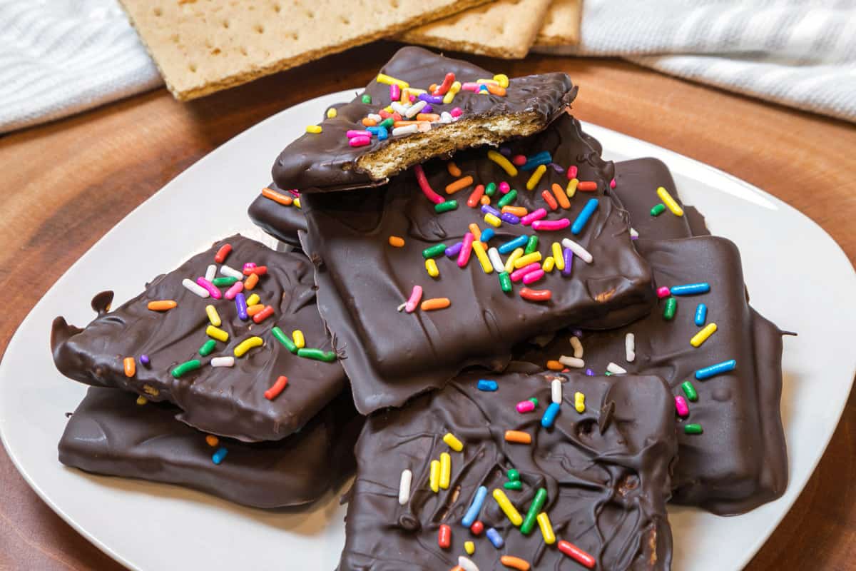 Chocolate covered graham crackers on a plate.