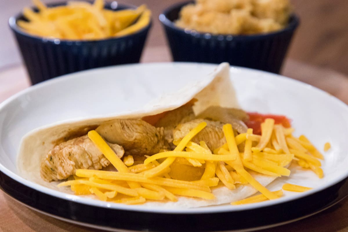 Skillet chicken fajitas on a plate.