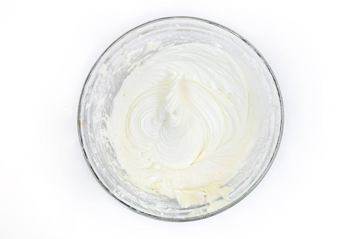 The powdered sugar, milk, and salt are mixed together with the melted white chocolate mixture.
