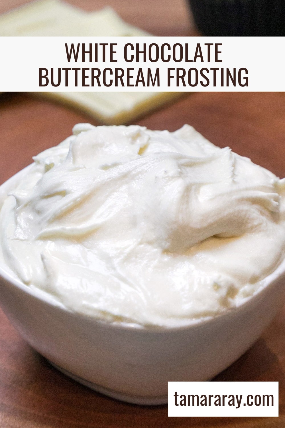 A close up shot of white chocolate buttercream frosting in a bowl.