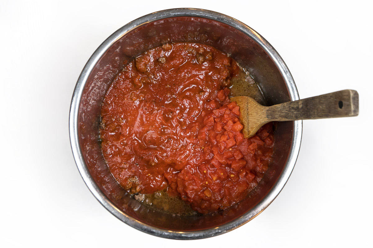 Pasta sauce, Italian diced tomatoes, petite diced tomatoes together with browned ground beef.