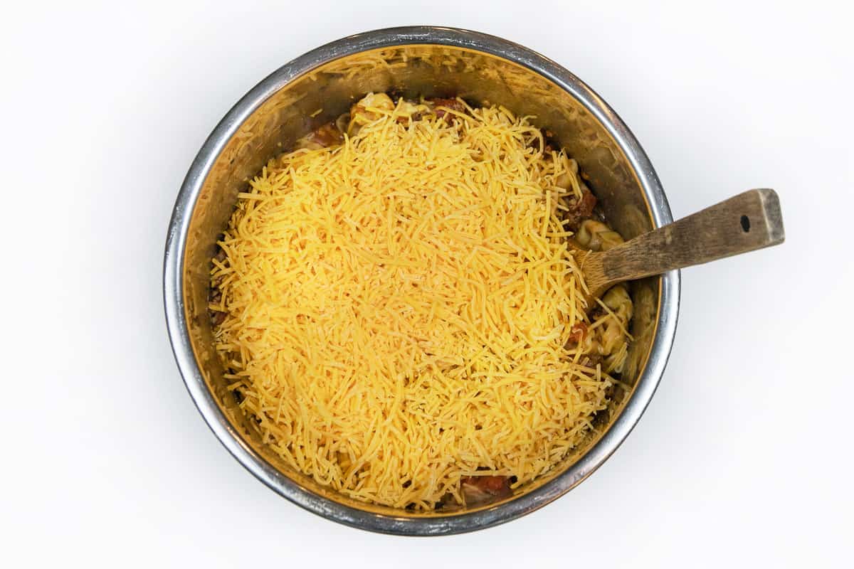 Add cheese to the top of the tortellini.