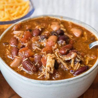 Chicken chili with black beans recipe in a gray bowl.