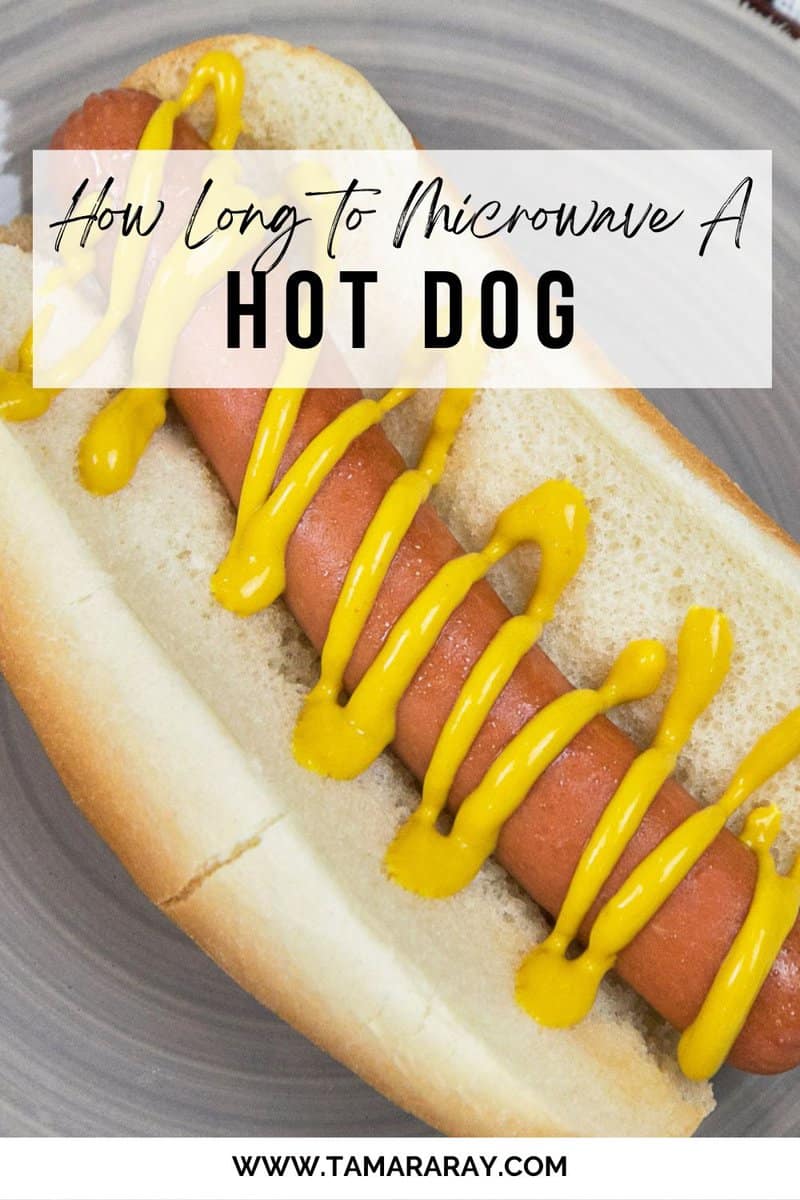 A hot dog in a hot dog bun on a plate.