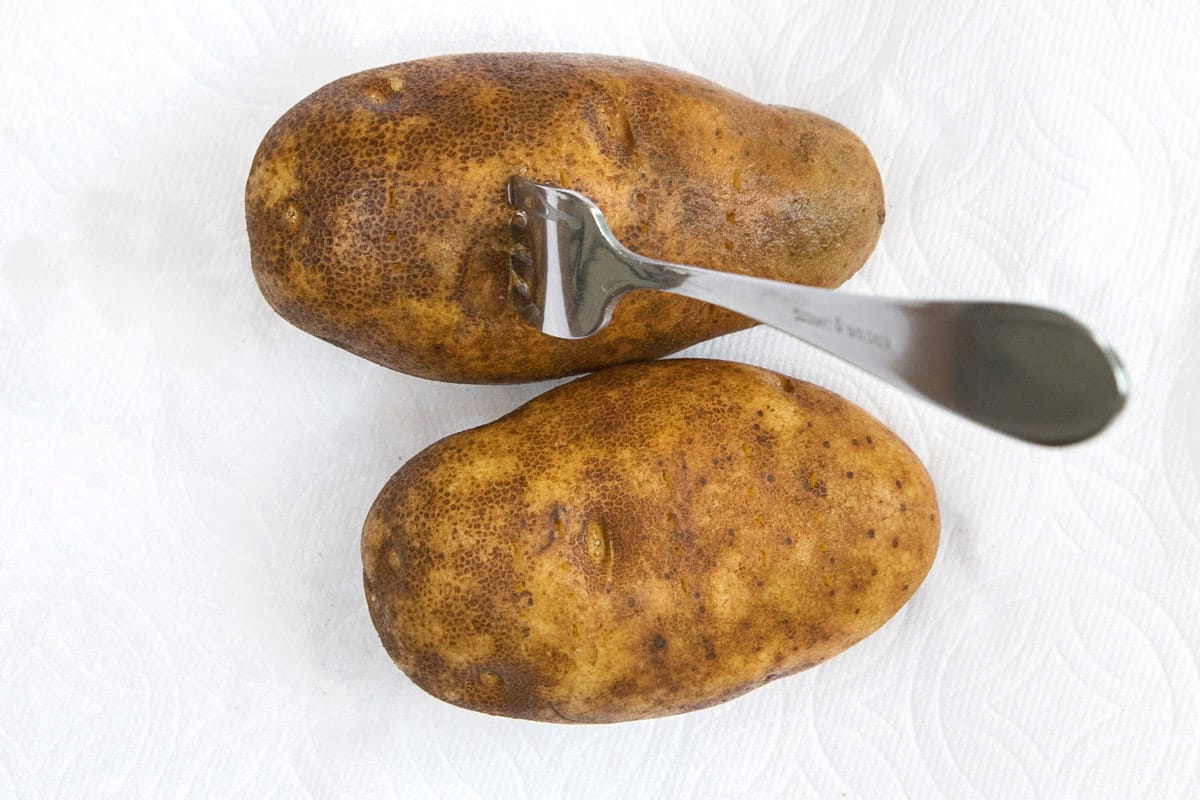 Poke holes in the potatoes so they won't explode.