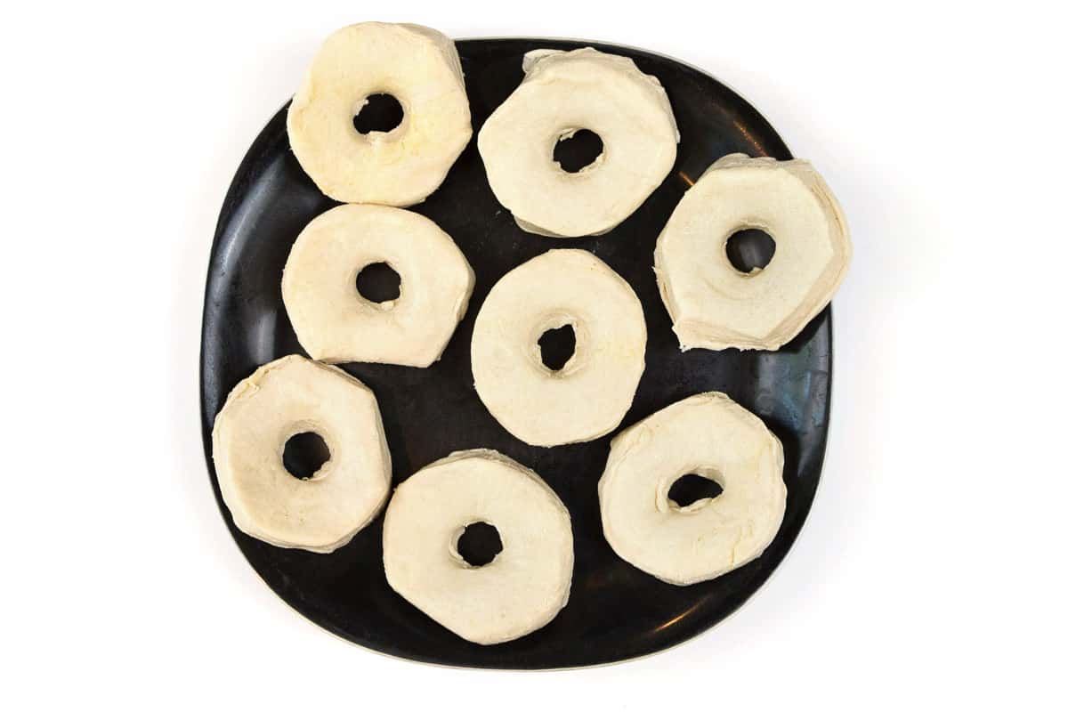 Make a donut hole in the center of the biscuit.