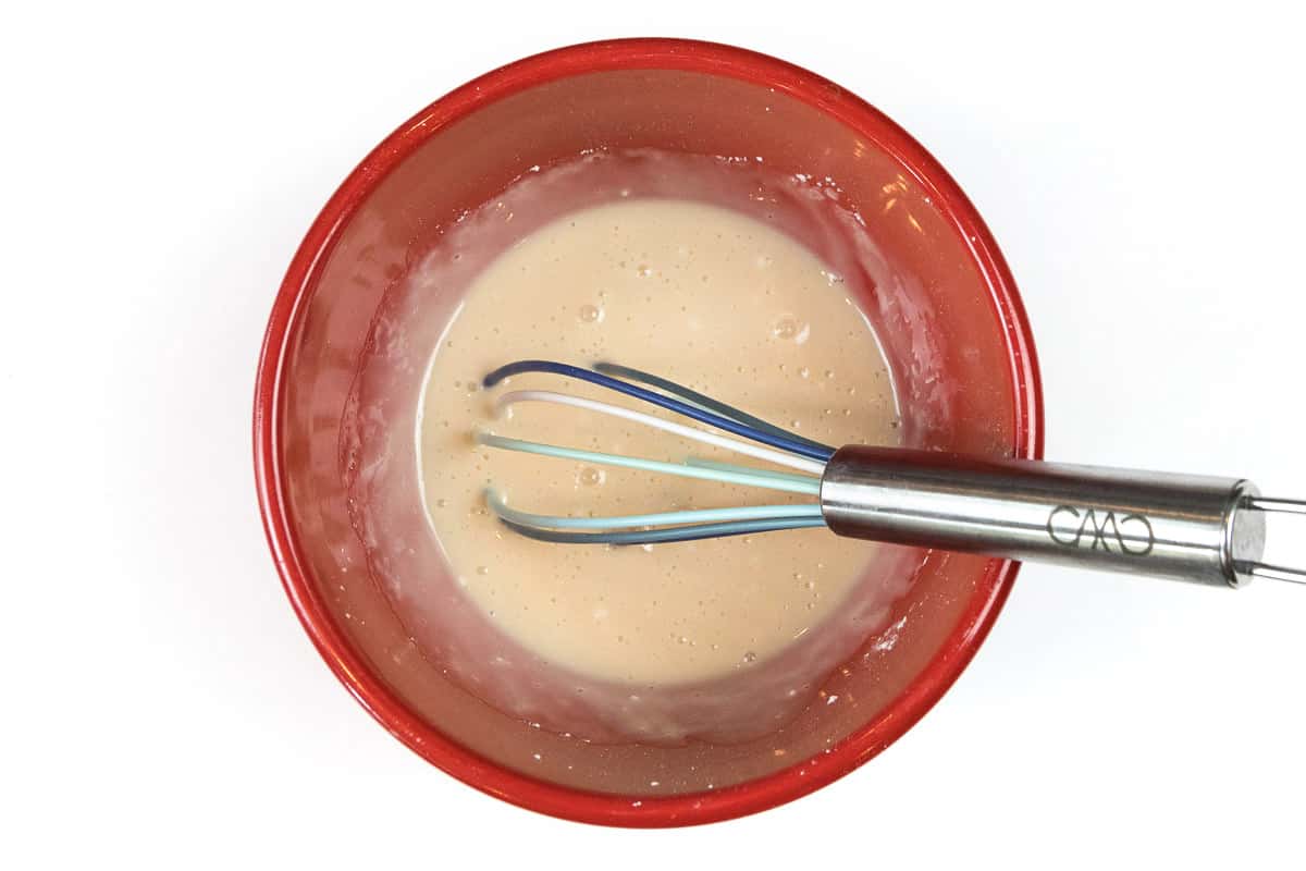 Stir the powdered sugar, milk, and vanilla extract in the bowl.
