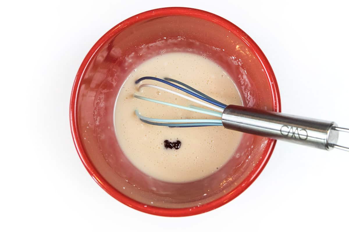 Add the food coloring together with the powdered sugar, milk, and vanilla extract.