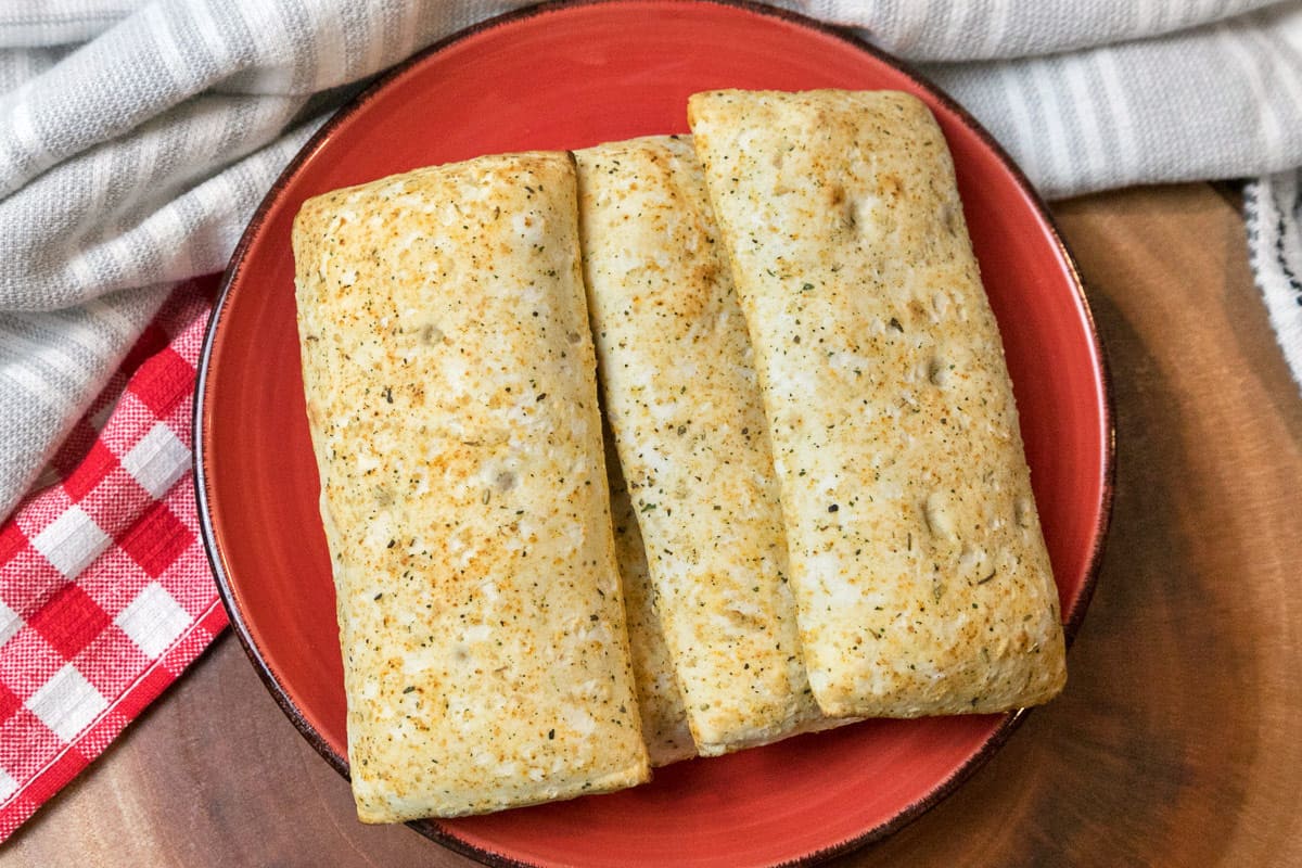 Crispy air fryer hot pockets on a plate.