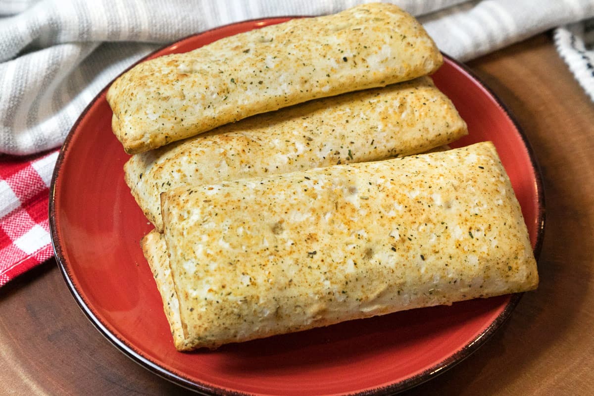 Crispy air fryer hot pockets on a plate.