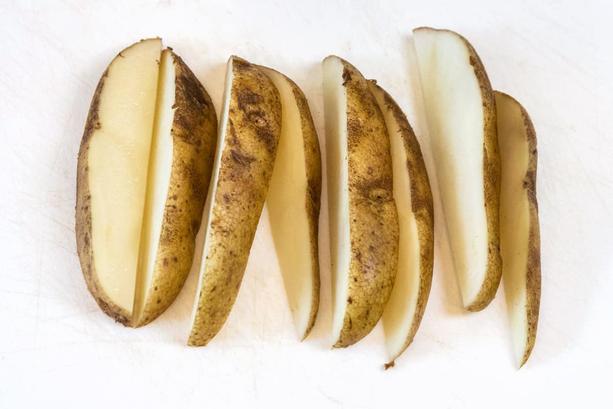 A potato that is cut into eighths.