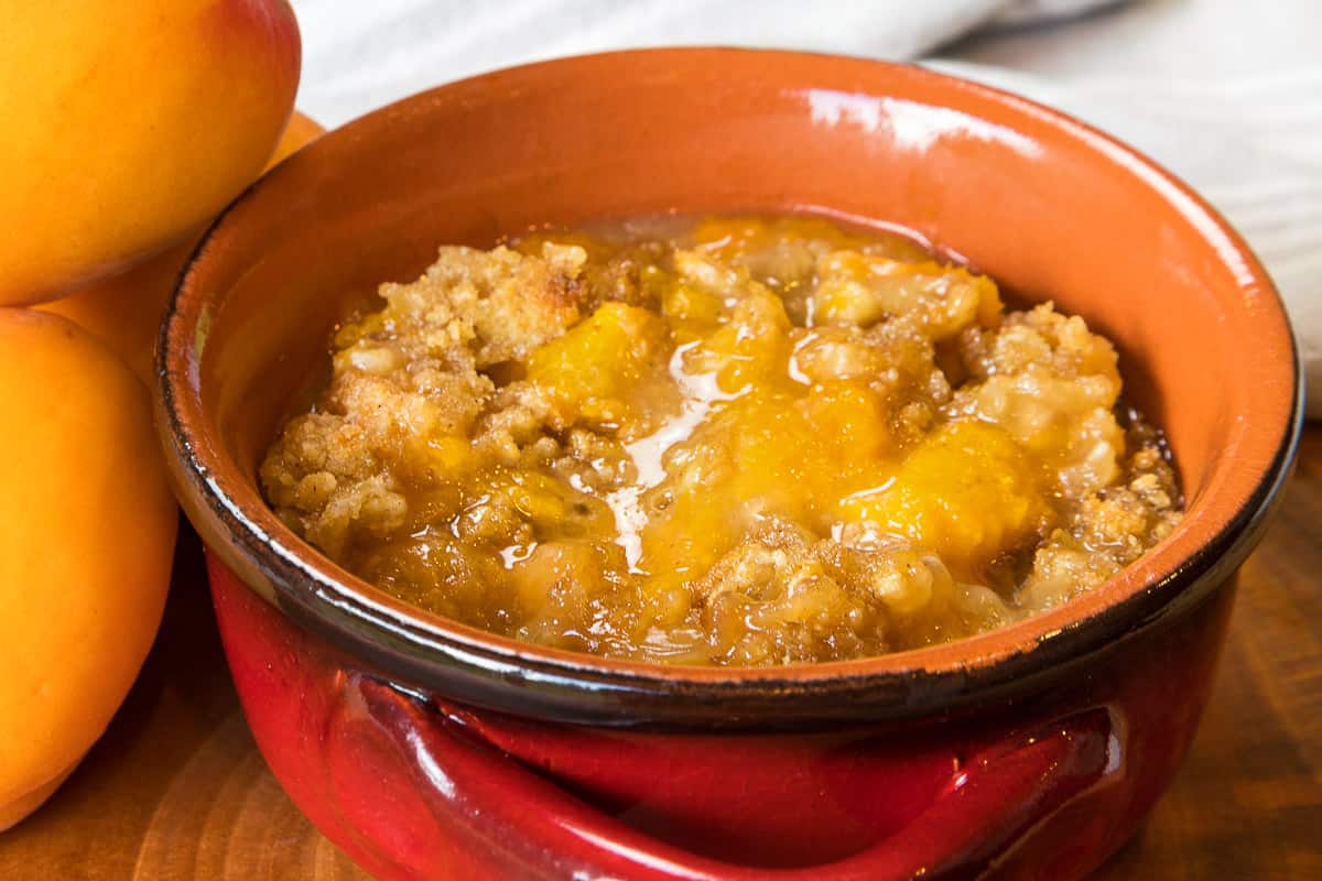 Tart apricot crisp in a bowl.