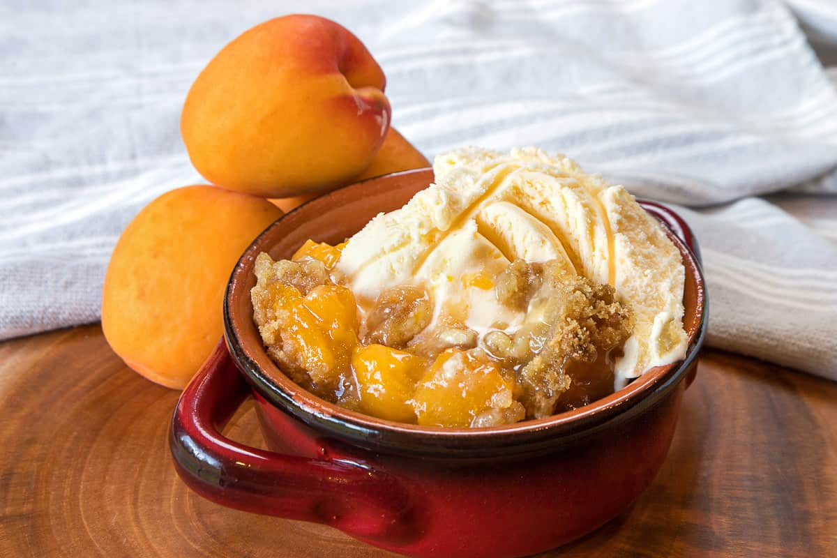 Tart apricot crisp in a bowl.