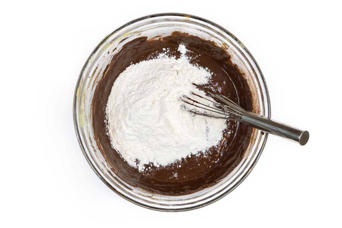 Add the flour mixture together with the mashed avocado mixture.