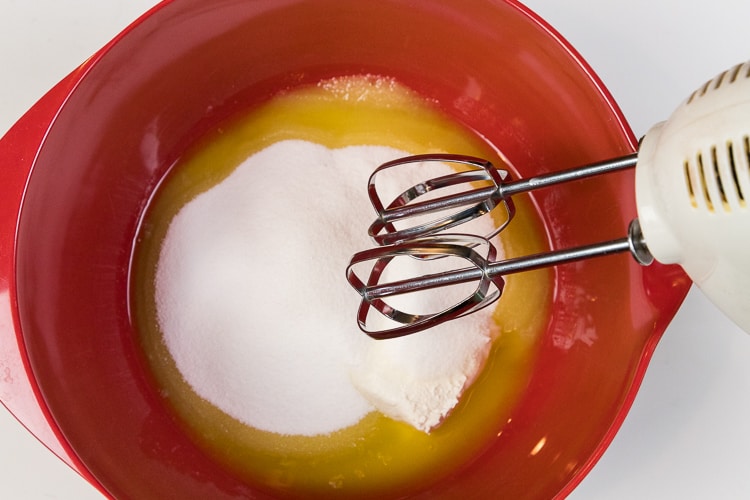 Melted butter, cream cheese, and sugar in a bowl.