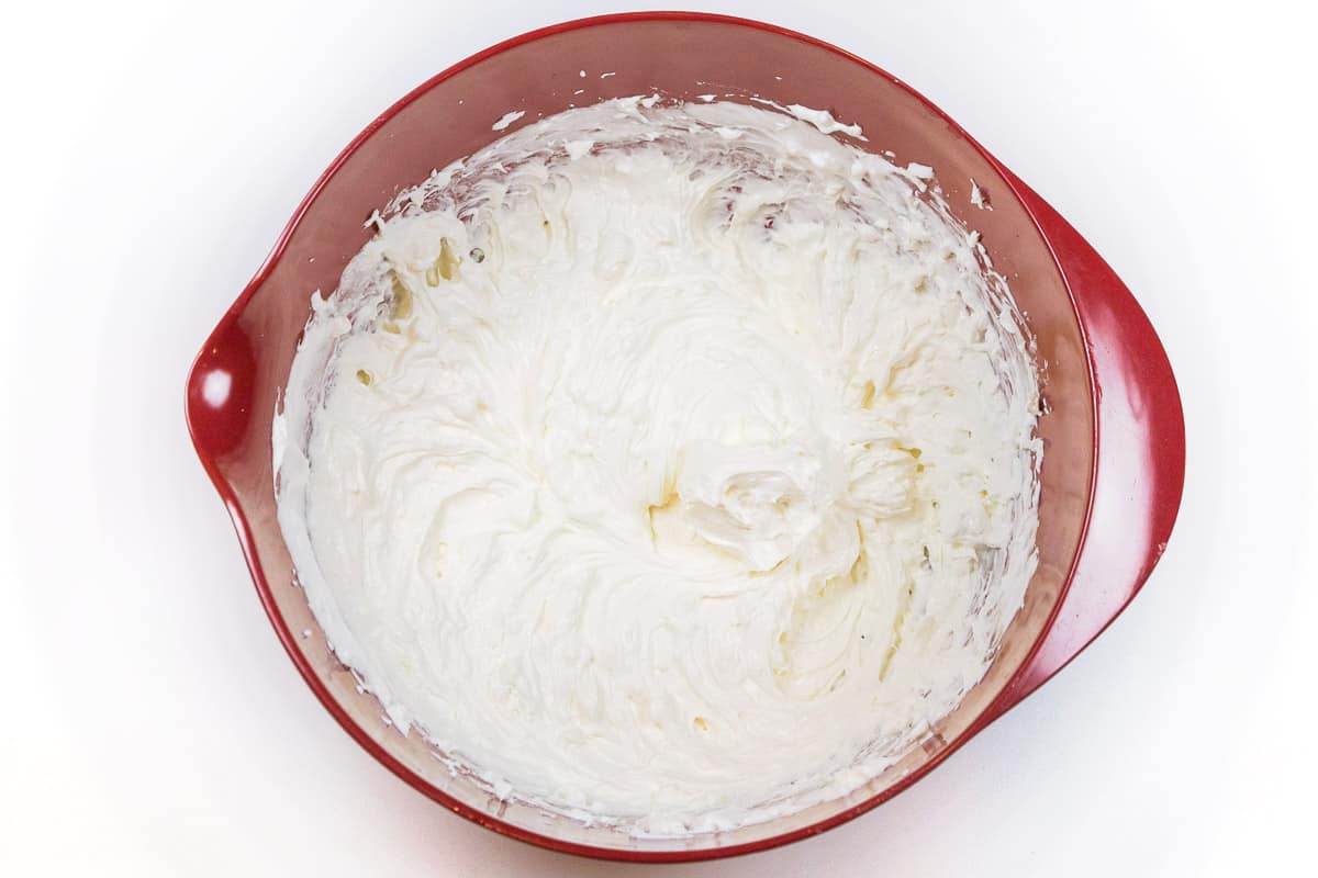 The cream cheese and whipped topping are mixed thoroughly.
