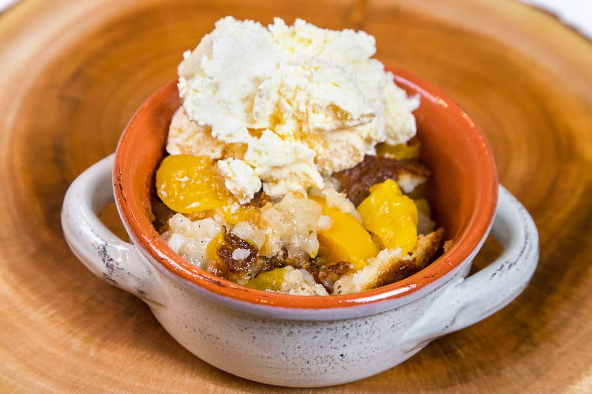 Bisquick peach cobbler in a bowl.