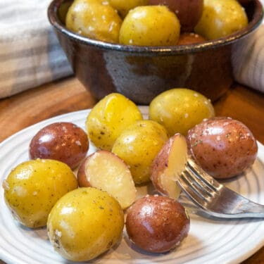 Boiled baby potatoes recipe on a plate.