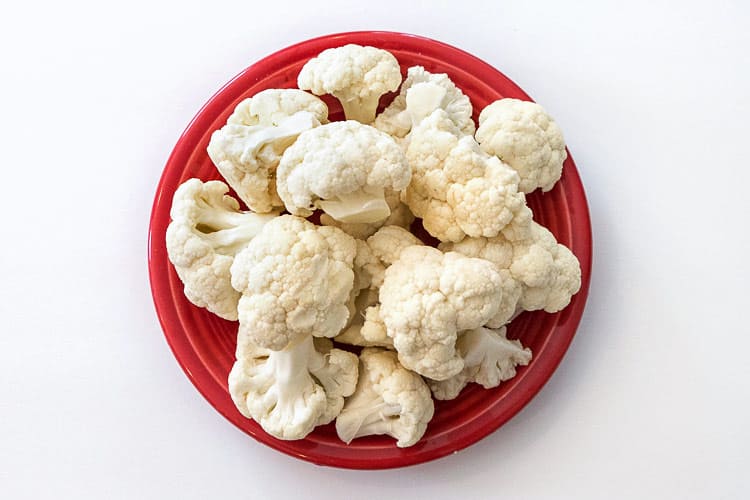 Cauliflower florets on a plate.