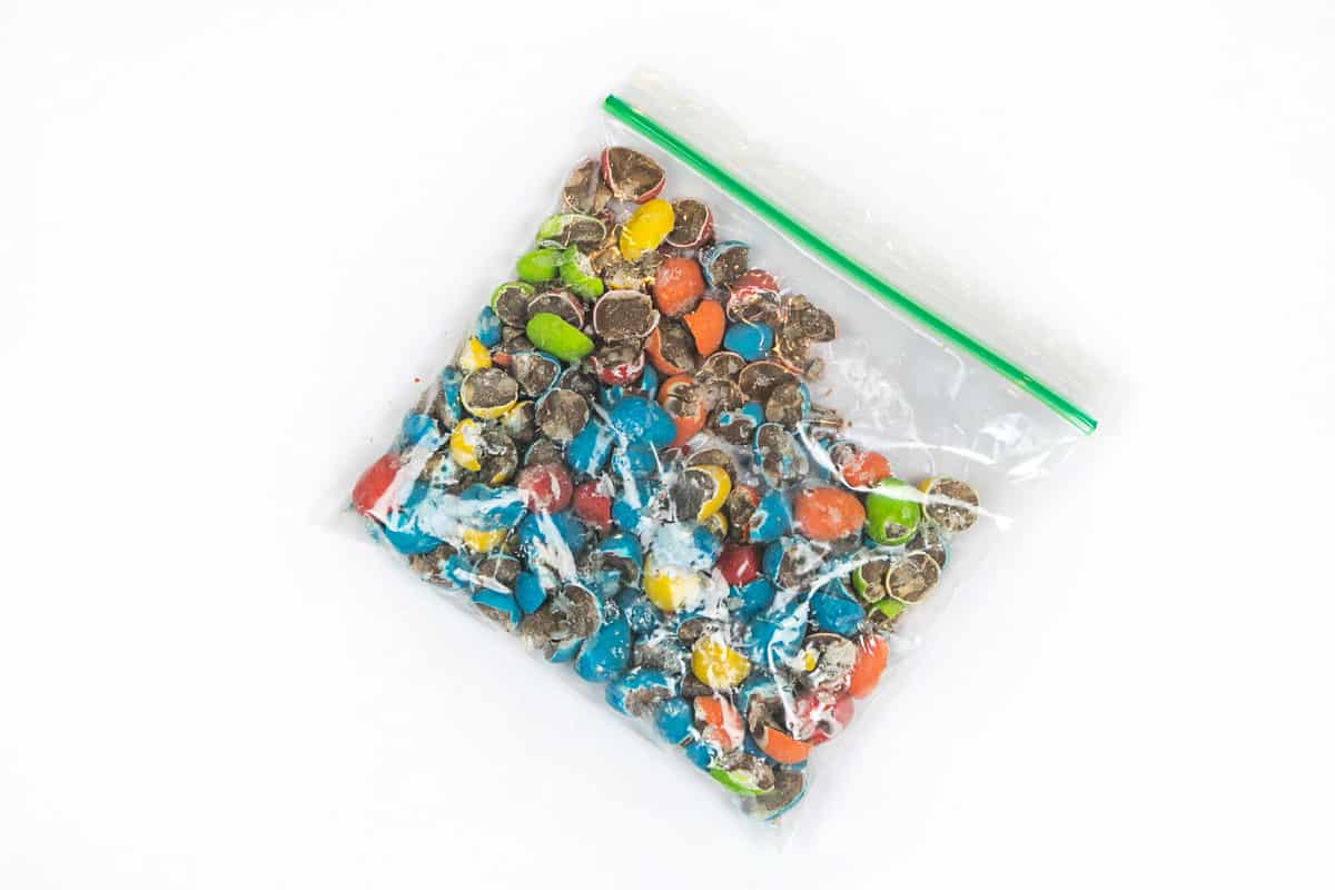 The mini Cadbury eggs are broken into pieces in the ziplock bag.