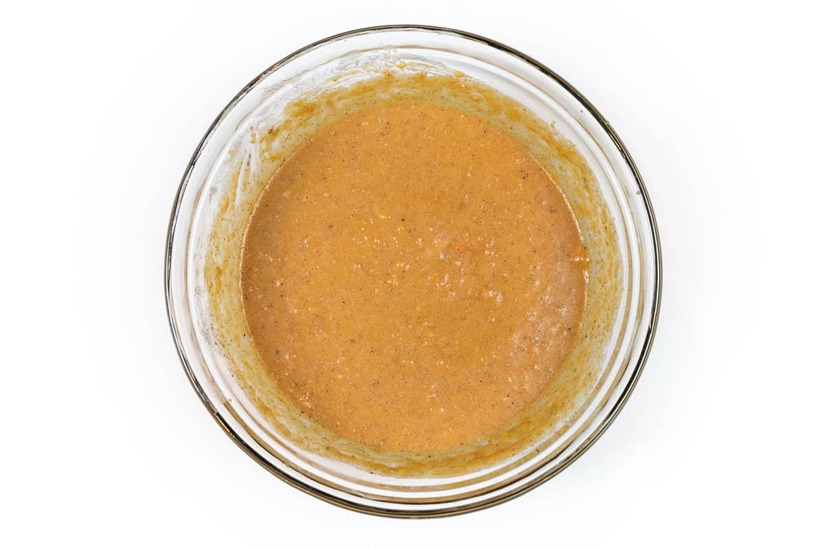 The melted butter, evaporated milk, lemon juice, ground cinnamon, and light brown sugar are mixed in a bowl.