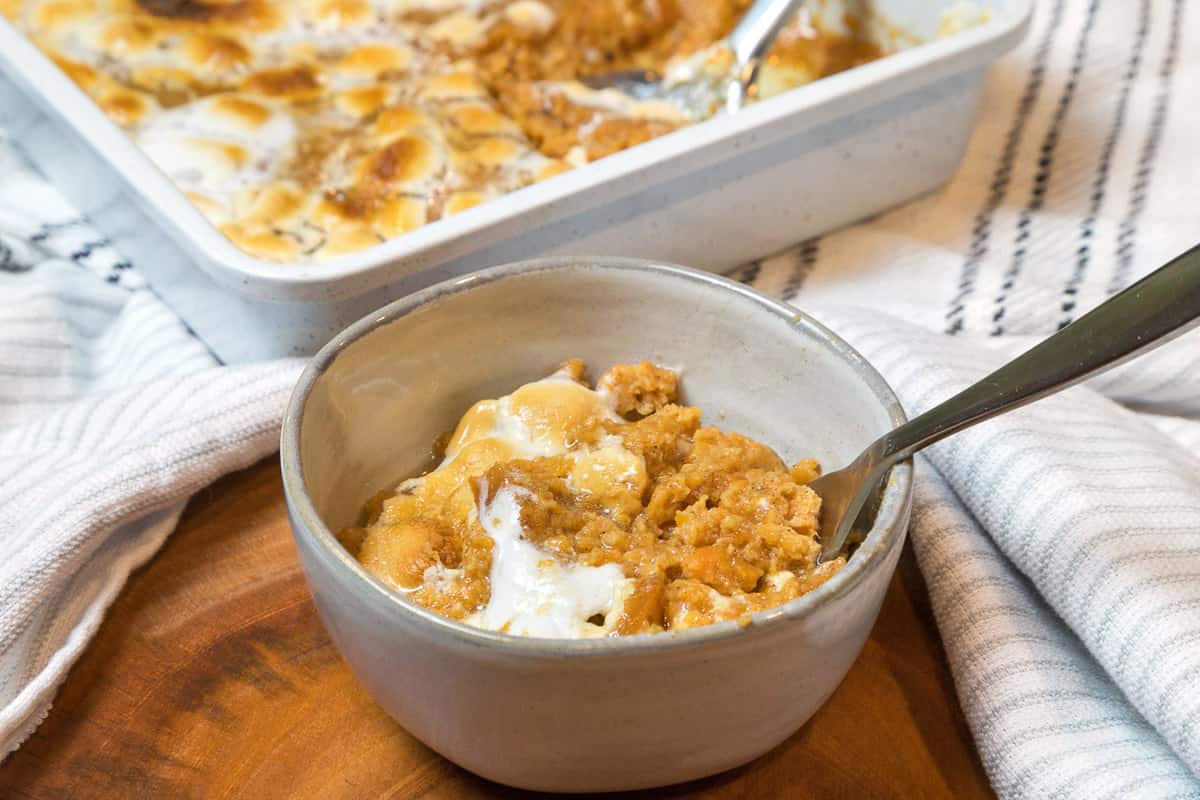 Baked sweet potato casserole in a bowl.