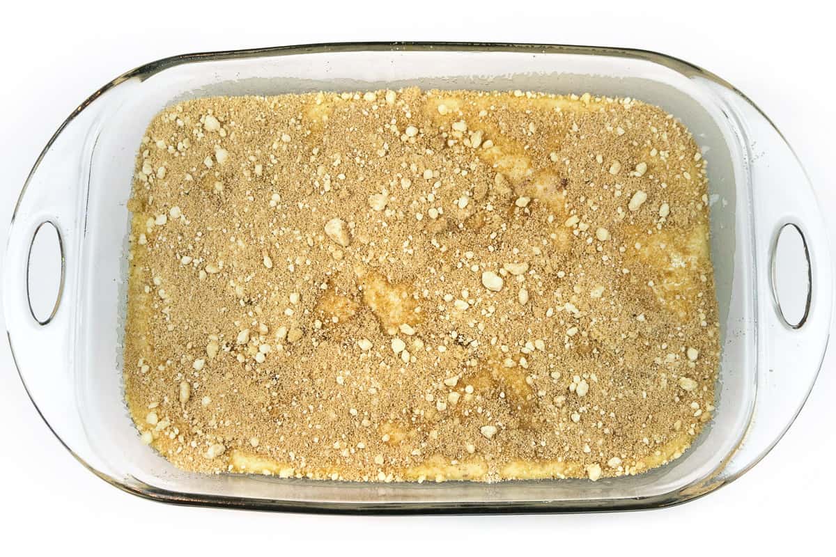 Crumble topping is sprinkled on top of the coffee cake batter.