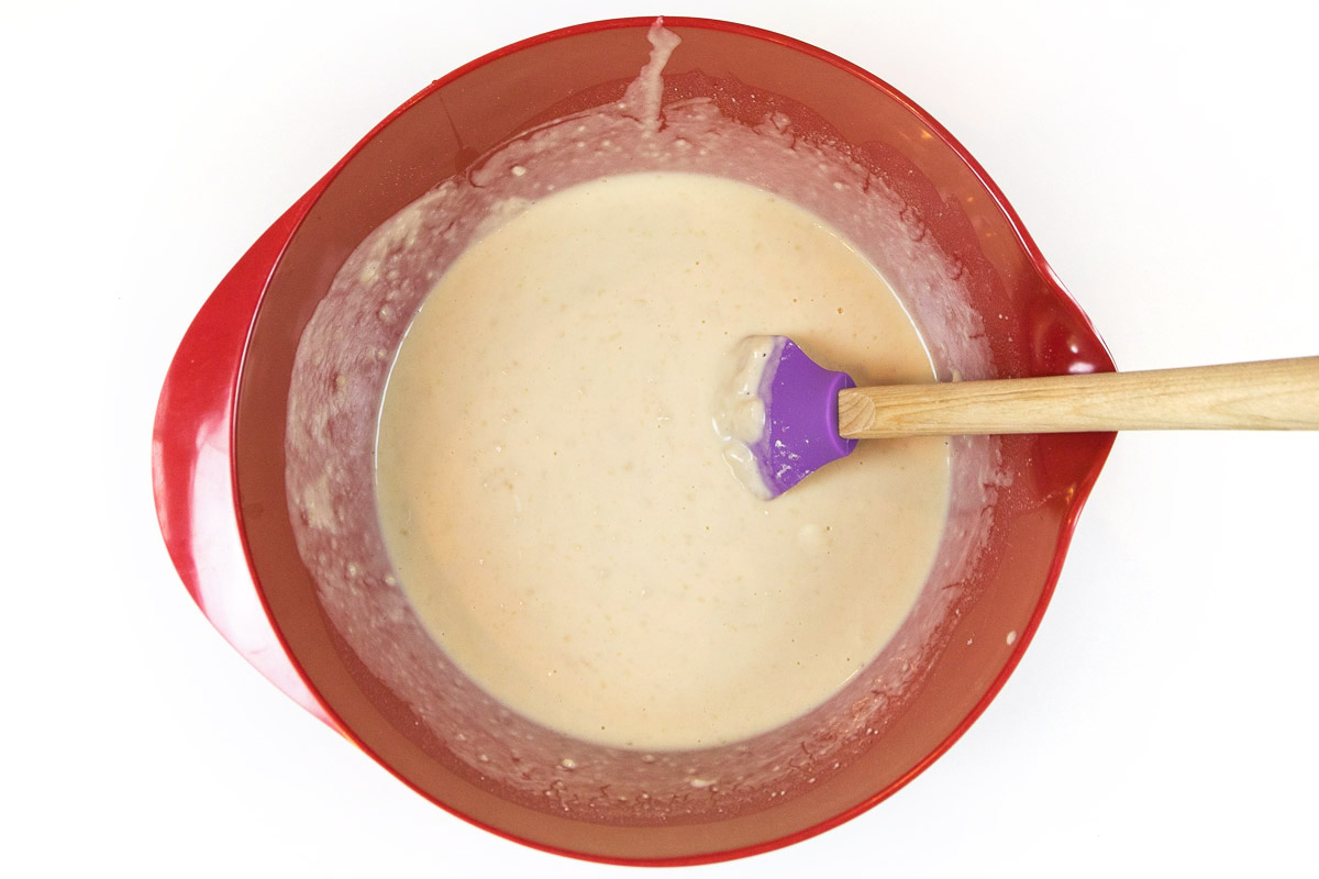 Mix the yeast mixture, egg, and crumbly mixture until blended well into a smooth cake-like batter.