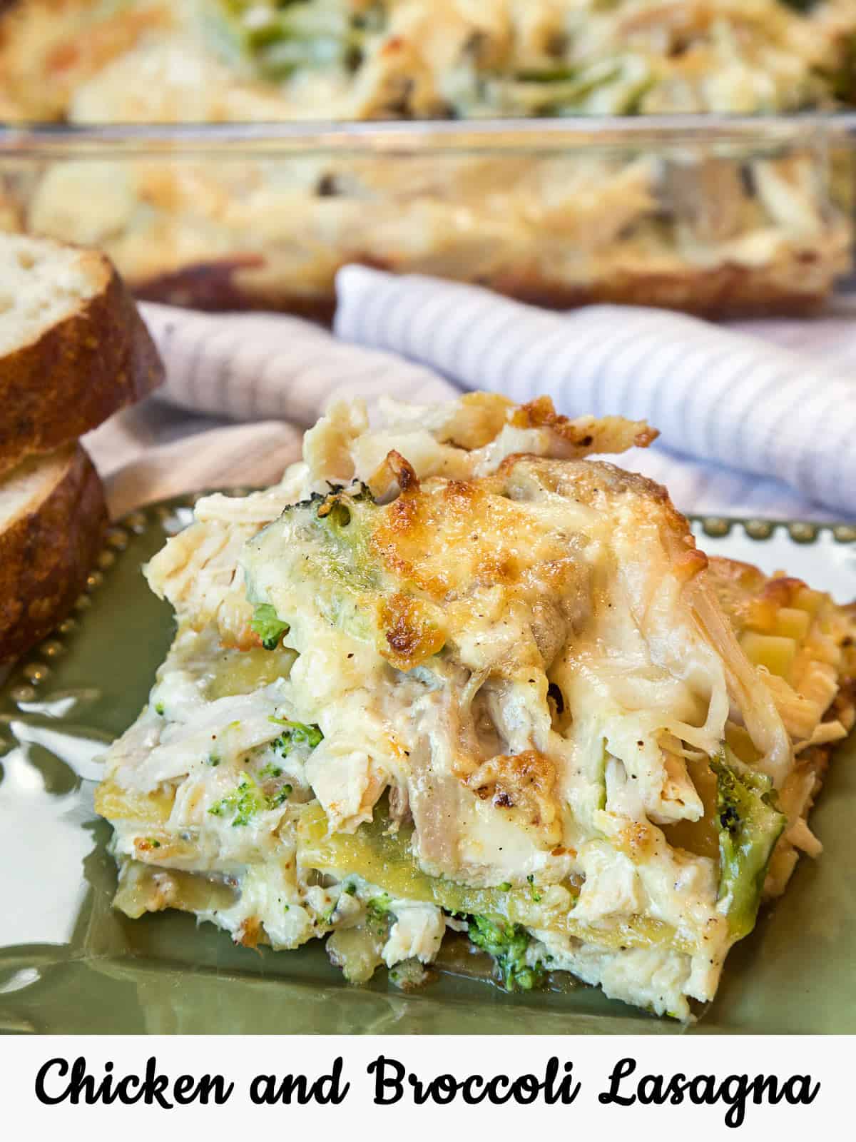 A close-up photo of a slice of chicken and broccoli lasagna that is ready to serve on a plate.