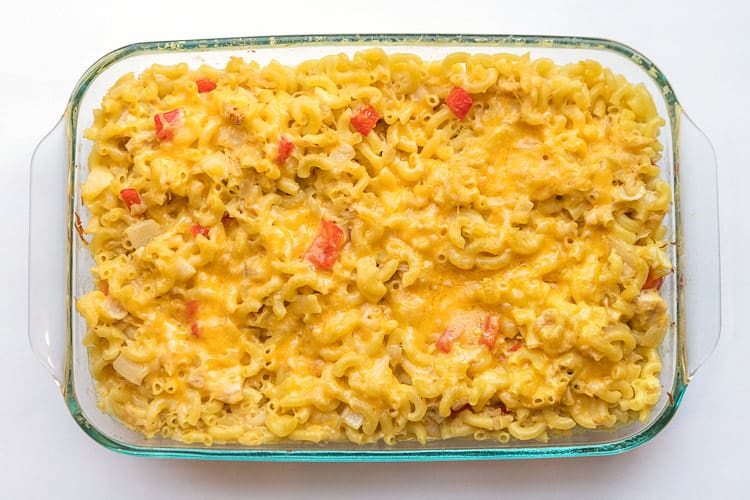 Baked chicken casserole with noodles in a baking dish.