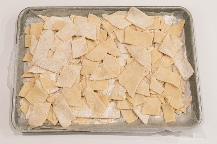 The dumpling dough is cut into strips.