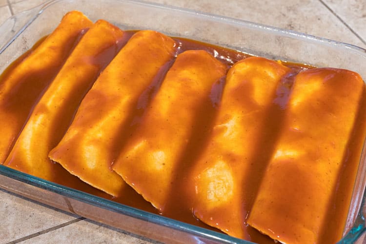 Dump sauce over the top of Chicken Enchiladas
