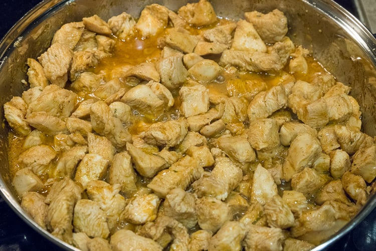 Keep frying the chicken until there is no more pink showing.