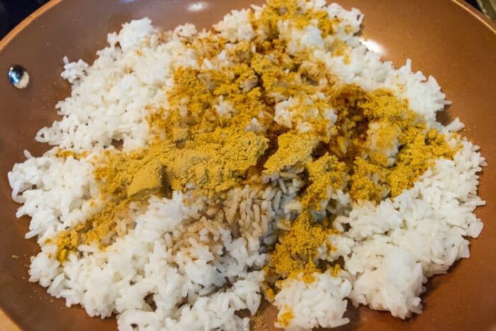 Seasoning mix added to rice.