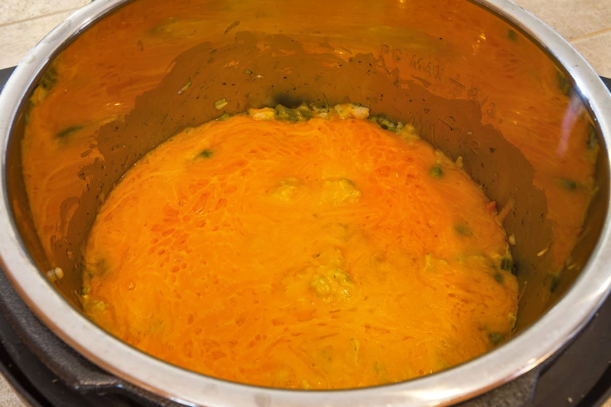 Cheese melted over chicken and rice casserole.