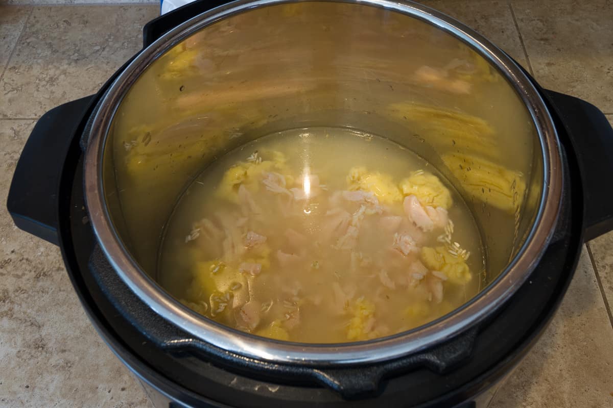 Cream of chicken soup and one can of chunk chicken breast is added to the rice and water.