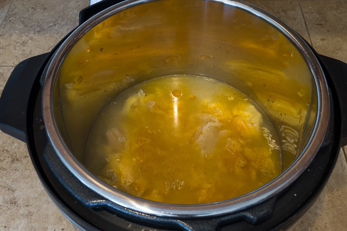 Add the chicken flavor bouillon, onion salt, and garlic powder with the liquid ingredients in the instant pot.