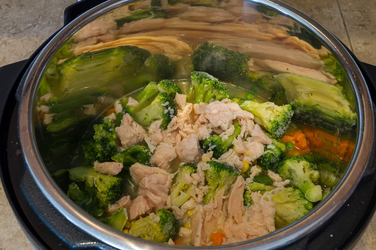 The second can of chunk chicken is added.