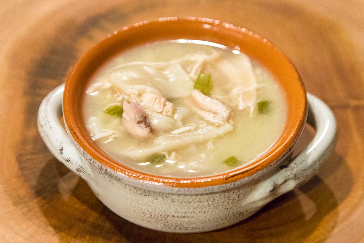 Chicken and dumpling soup in a bowl.