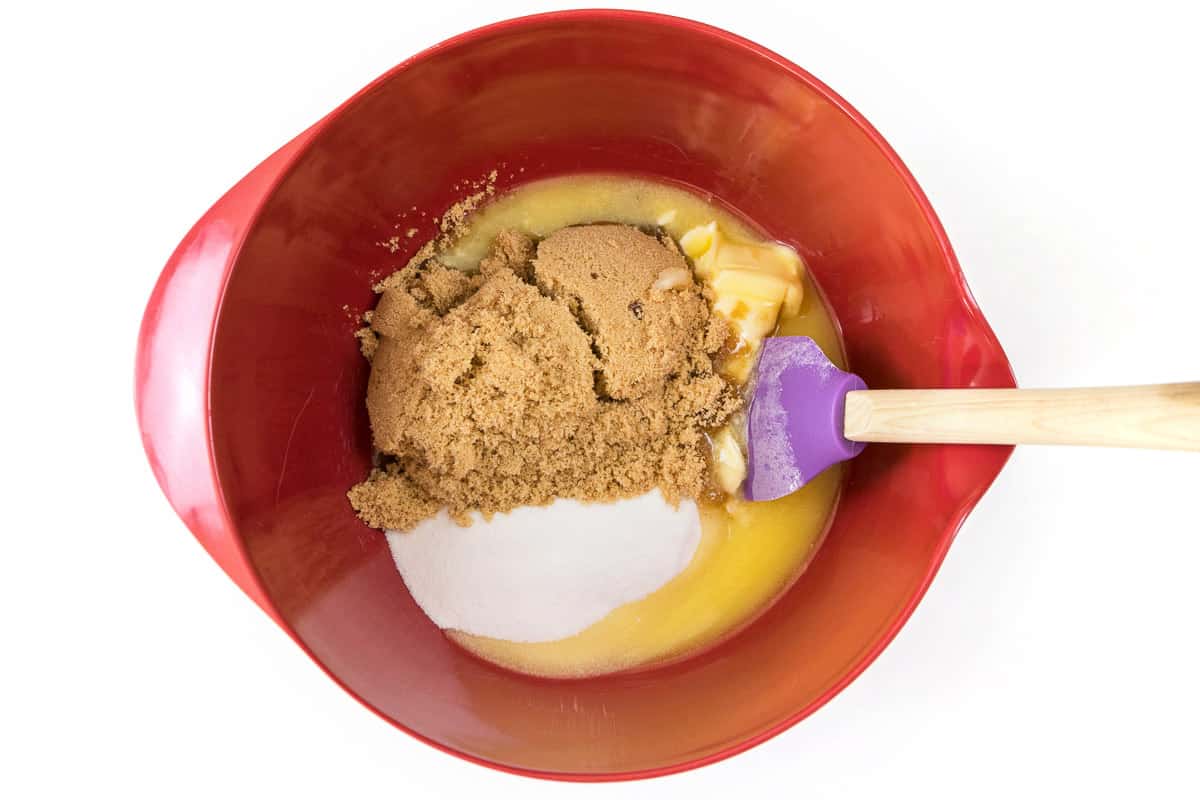 The softened butter, sugar, and light brown sugar in a bowl.