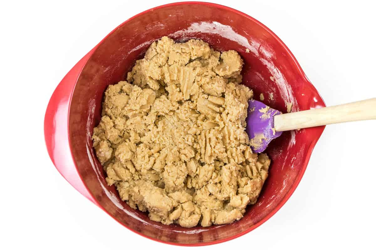 Mix the flour mixture with the eggs, vanilla extract, softened butter, sugar, and light brown sugar until well blended.