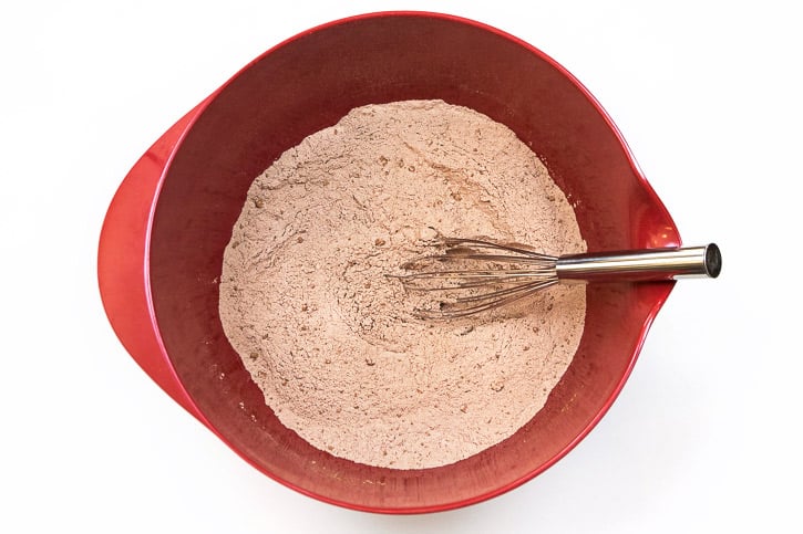 Whisk the flour, unsweetened cocoa powder, table salt, and baking powder together in the bowl.