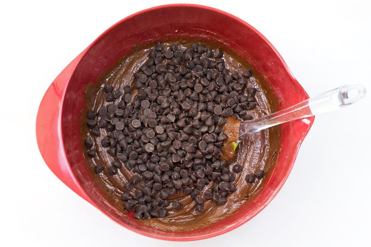 Chocolate chips are added to the cookie dough.