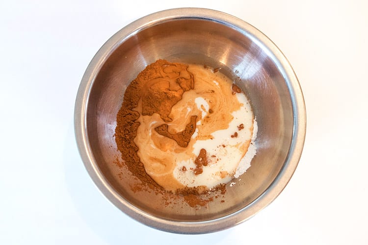 Three-fourths of a cup of skim milk is added to the cocoa and cornstarch.