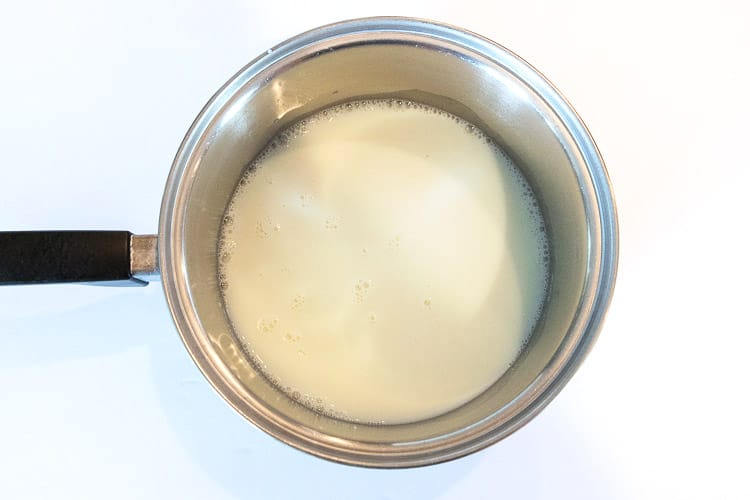 Remaining one and a half cups of skim milk, one half cup of sugar, and one-eighth teaspoon of salt in a bowl.