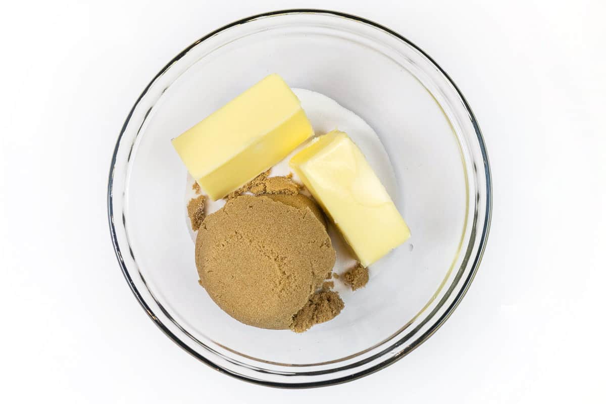 Softened butter, light brown sugar, and granulated sugar in a bowl.